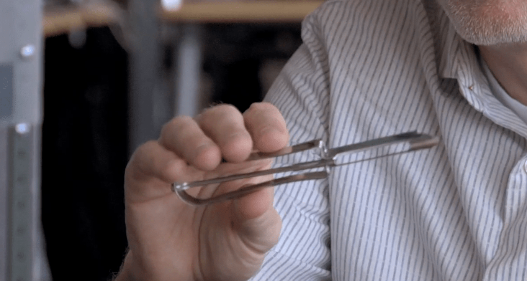 A view of the original kitchen vegetable peeler made of metal.